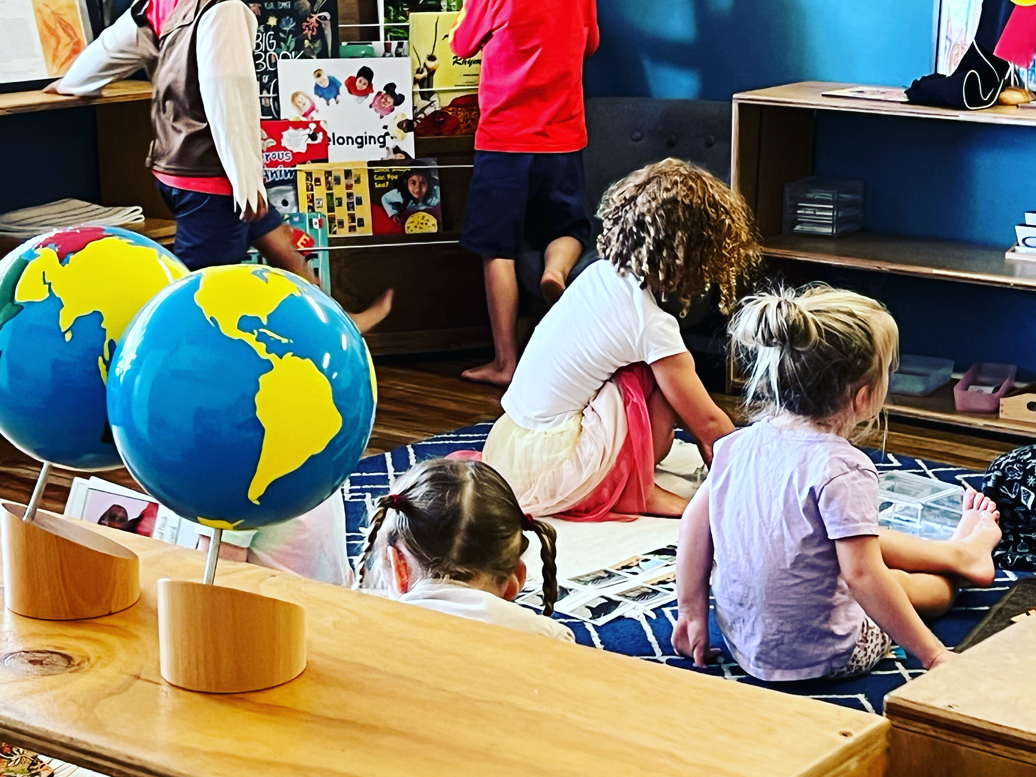 Children engaged in Montessori learning at The Hills